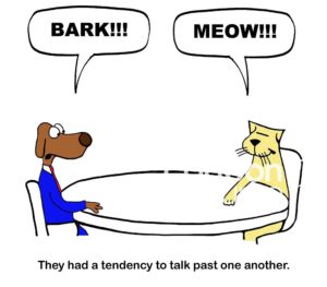 Color conflict cartoon showing a professional dog barking and a cat meowing, they had a tendency to talk past one another.