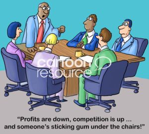 Color boss cartoon showing a team meeting. The black, male boss says 'profits are down, competition is up and someone is sticking gum under the chairs'.