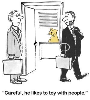 B&W boss cartoon showing a boss cat in the background and one employee saying to another, 'careful, he likes to toy with people'.