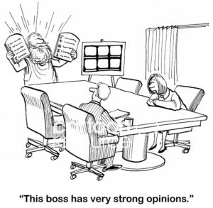 Leadership cartoon showing a business meeting and Moses leading the meeting.  The business woman says to a coworker, "this boss has very strong opinions".