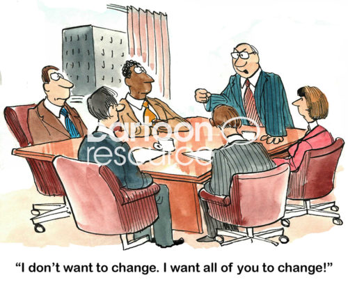 Color change cartoon showing a boss standing and pounding the table telling his team, 'I do not want to change.  I want all of you to change'.