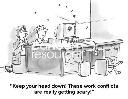 B&W conflict cartoon showing two worker people hiding behind a desk with bullet holes in the wall behind them. "Keep your head down! These work conflicts are really getting scary'.