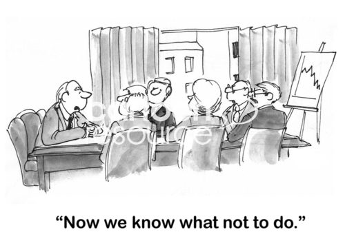 B&W finance cartoon showing a team meeting and chart with declining sales, 'now we know what not to do'.