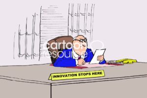 Color marketing cartoon showing an old-fashioned, male, business boss who has a big sign on his desk - innovation stops here.