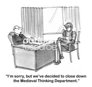 Education B&W cartoon showing a man wearing medieval armor and a male boss. The boss is telling him they are closing '... down the Medieval Thinking Department'.
