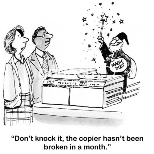 Office cartoon showing a magician fix the broken copier with magic dust, "don't knock it, the copier has not broken in a month".