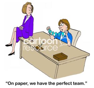 Teamwork color cartoon showing a female team leader looking at paper dolls and saying, "on paper, we have the perfect team".