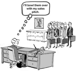 B&W sales cartoon of a businessman at his desk with a bowling ball, 'I'll bowl them over with my sales pitch'.