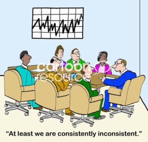 Color sales cartoon showing a male team boss trying to find something positive to say about the chart with extremely inconsistent sales, "at least we are consistently inconsistent".