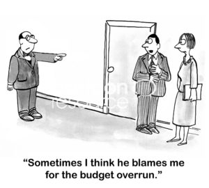 B&W accounting cartoons showing a boss appearing to blame a worker for the budget overrun.