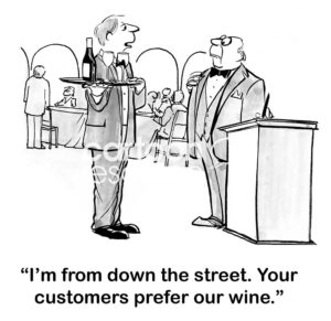 Restaurant B&W cartoon of a waiter saying to a maitre'd, "I'm from down the street. Your customers prefer our wine".