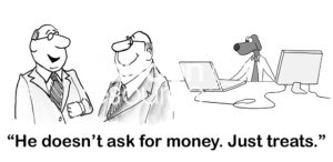 Office B&W cartoon of two office men with a business dog working on a computer in the background. One says of the business dog, 'he doesn't ask for money. Just treats'.