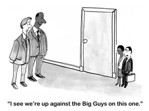 B&W business cartoon showing two large people and two small people, both in business. The small people say, 'I see we're up against the Big Guys on this one'.