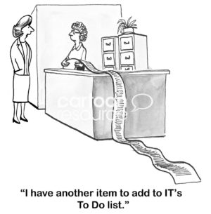 Technology B&W cartoon showing an office woman holding a very, very long list. Another woman walks up and states, 'I have another item to add to IT's To Do list'.