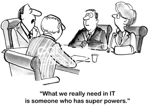 B&W office cartoon showing four people at a meeting table where the leader says to them, 'what we really need in IT is someone who has super powers'.