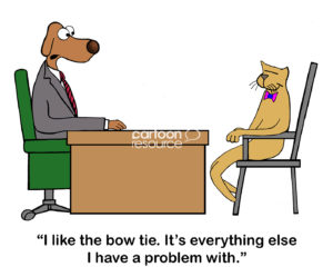 Color cartoon of a dog boss telling the cat employee the only thing the boss likes about him is his colorful bowtie.