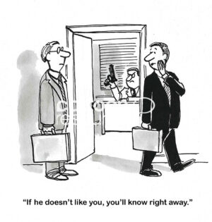 BW cartoon of a male boss holding a gun, in the background, and two executives communicating that 'if he doesn't like you, you'll know right away'.