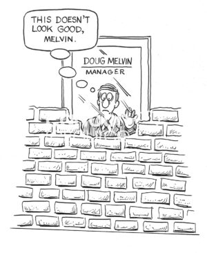 W cartoon showing bricks being built in front of the man's office - it does not look good.