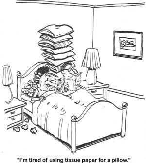 BW cartoon of a wife and husband who have a disagreement, he has ten comfortable pillows on the bed and she has none.