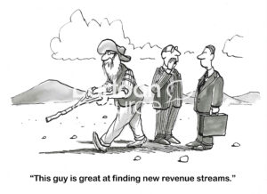BW cartoon of an old-timer searching with a diving stick out on a plain and one businessman telling another that the old-timer is great at 'finding new revenue streams'.